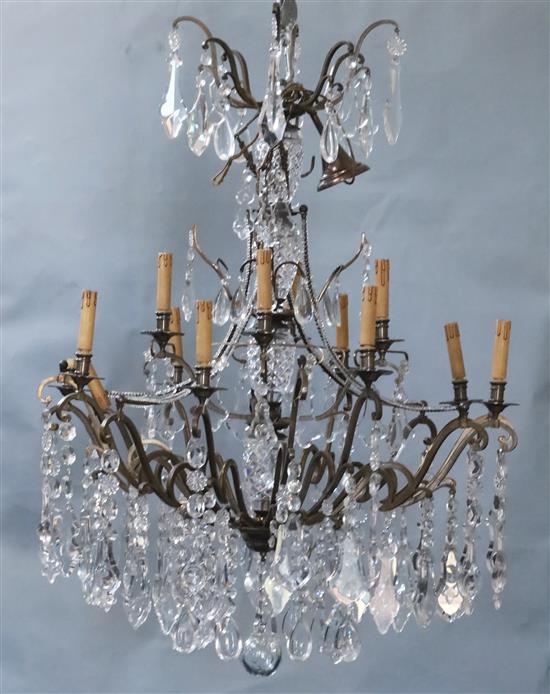 An Italian bronze and cut glass twelve light chandelier, overall drop 4ft Diam. 3ft